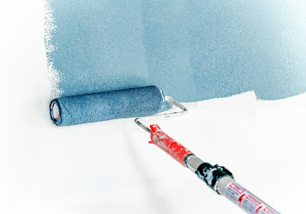 Close-up paint seam meeting architectural trim